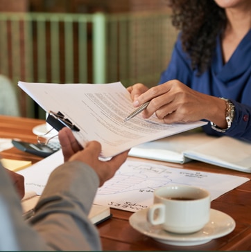 women is signing the contract women is signing the contract